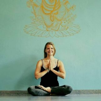 This picture shows teacher Milla in a Yoga pose