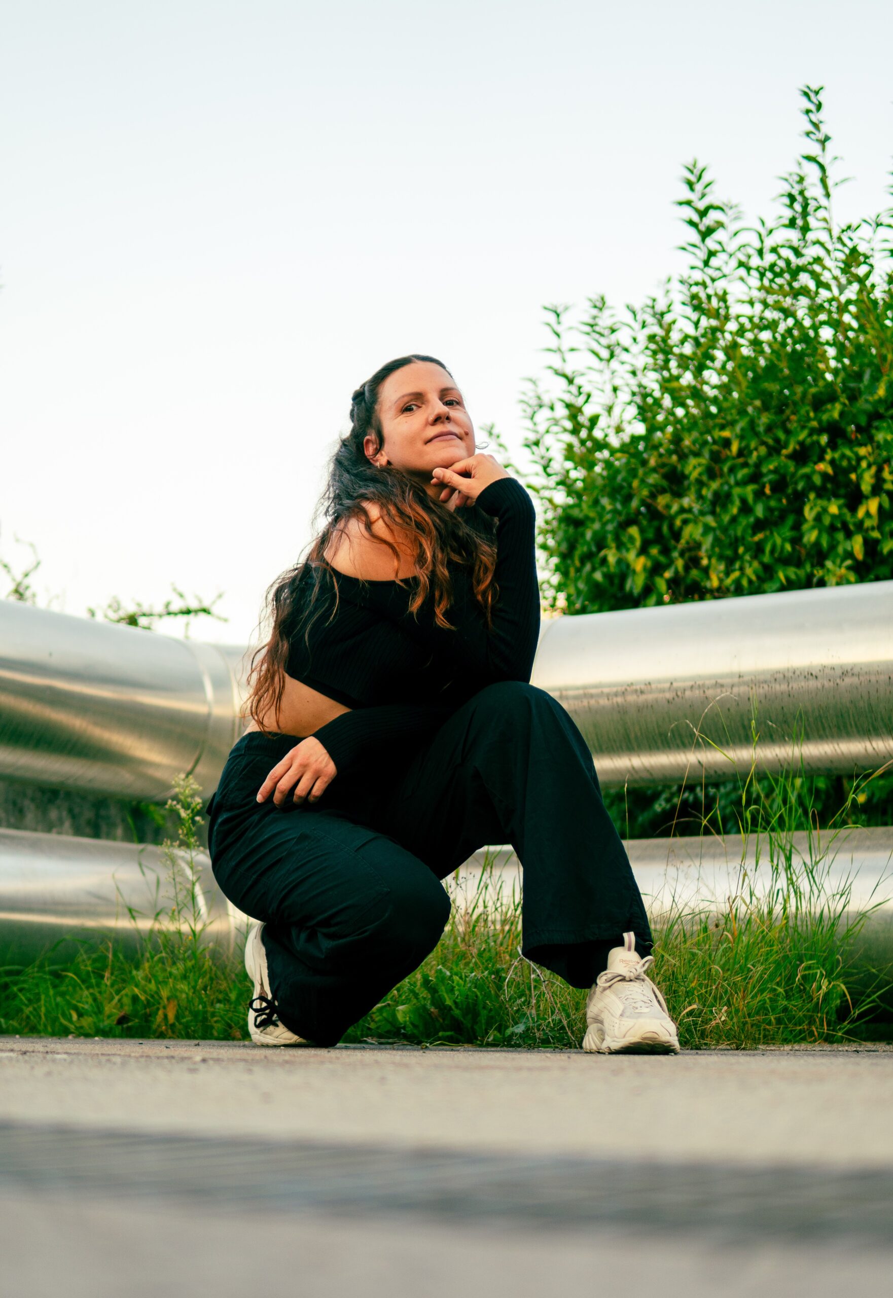 this picture shows an artist portrait of dance teacher Missa outside, posing for the camera